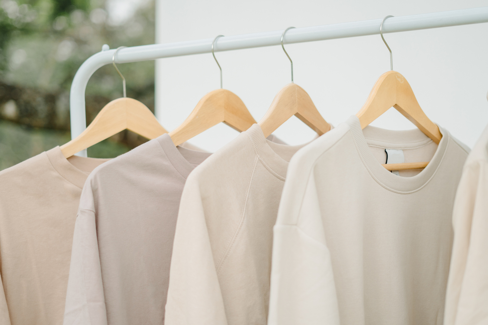 Earth Tone Colored Shirts Hanging on a Rack